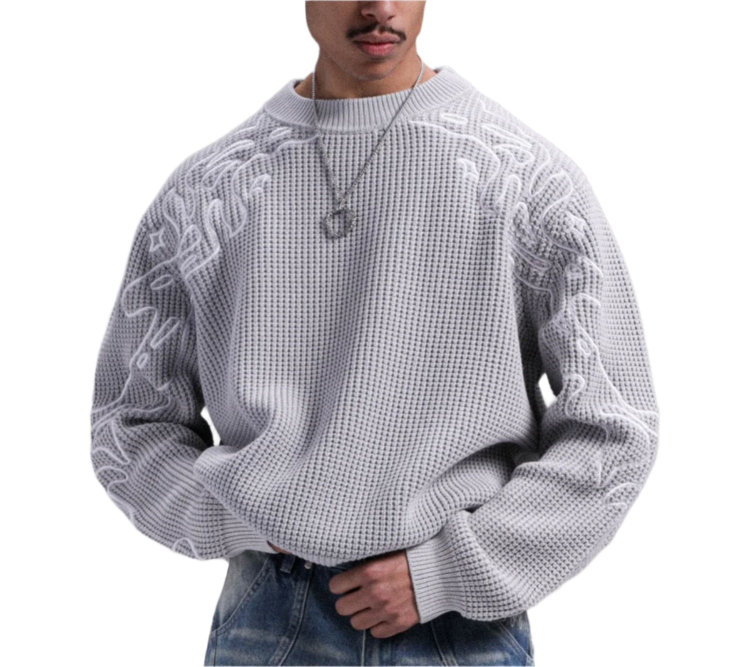 Person wearing a textured white sweater against a gray background