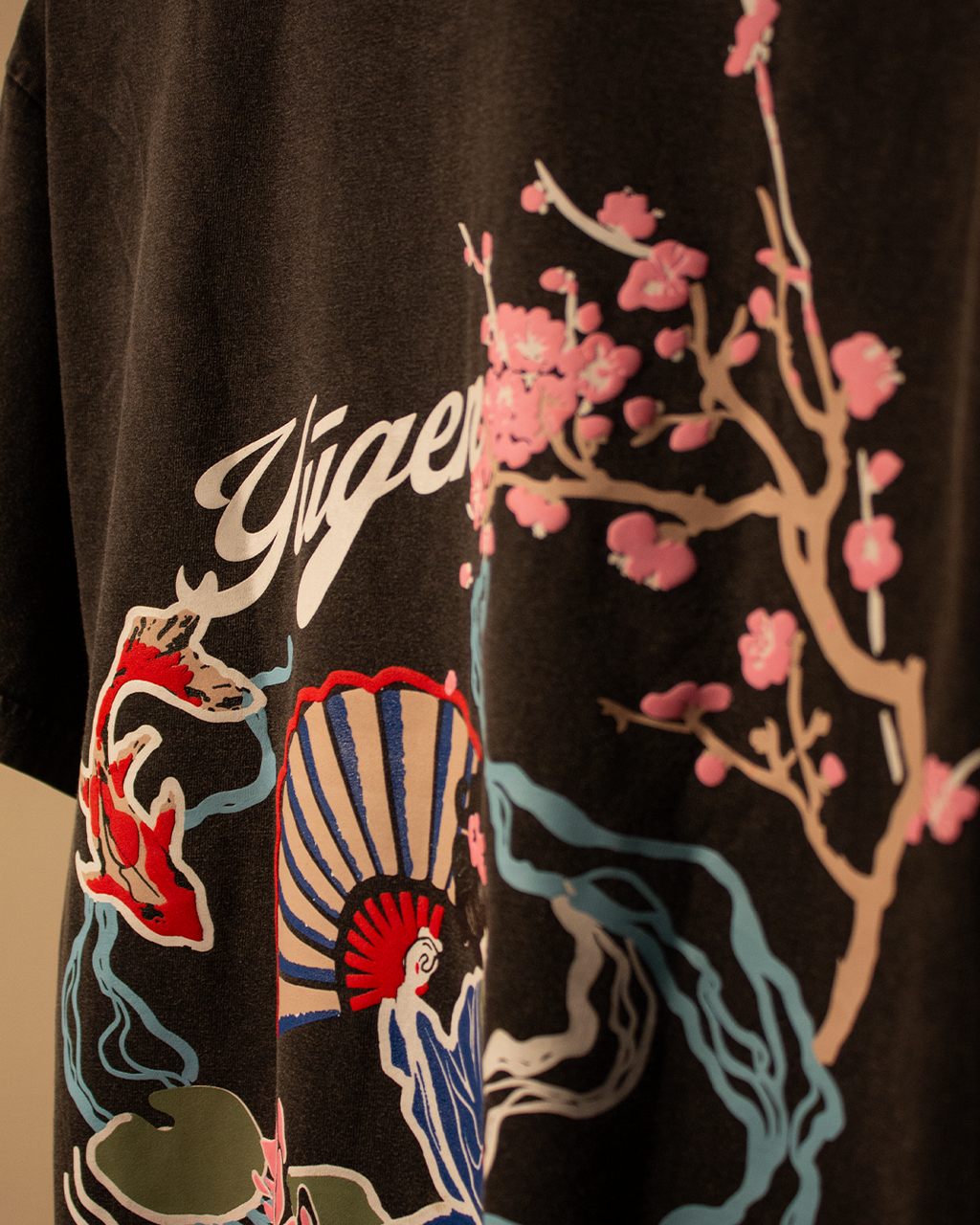 NVRFLD artistic tee with unique design featuring colorful floral and abstract patterns on black fabric