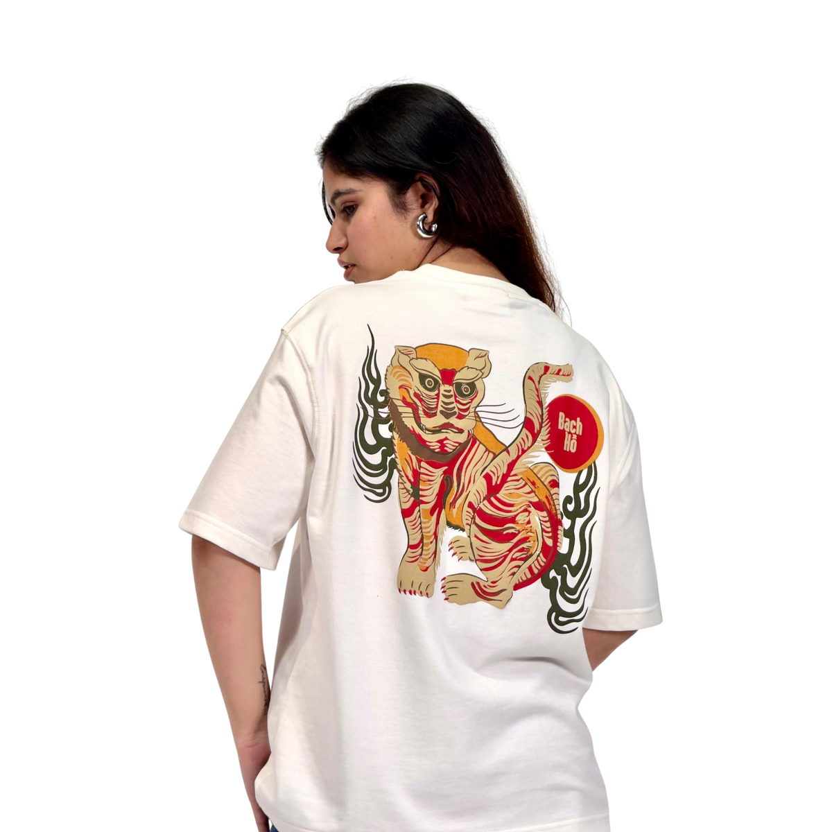 NVRFLD white bạch hổ graphic tee featuring a colorful tiger design on the back worn by a female model