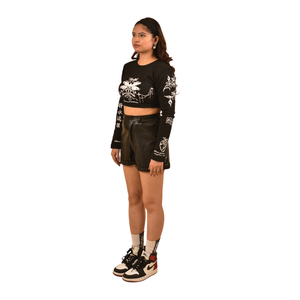 NVRFLD black club top long sleeve crop t-shirt with white graphic prints worn with black shorts