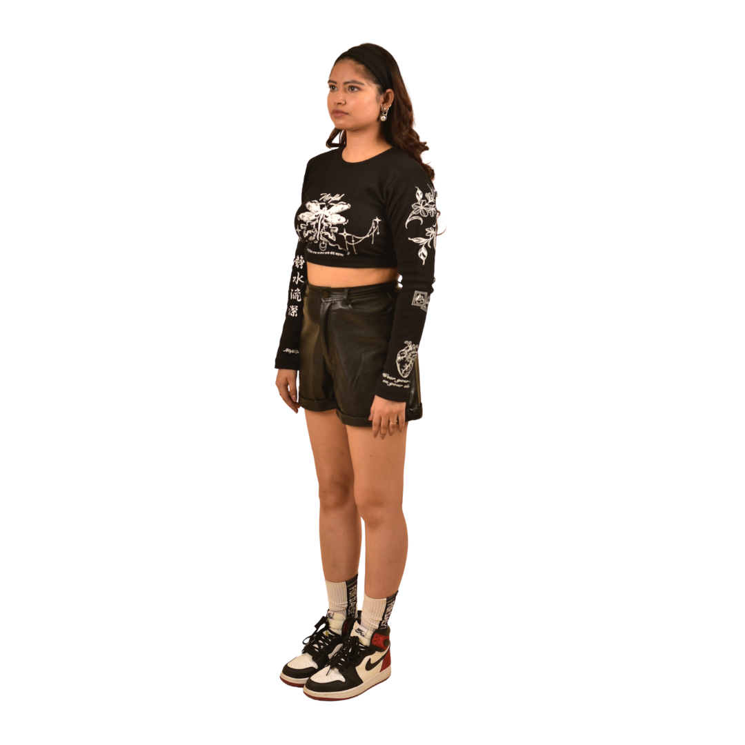 NVRFLD black club top long sleeve crop t-shirt with white graphic prints worn with black shorts