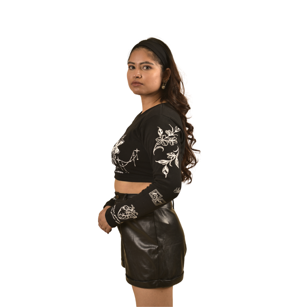 NVRFLD black club top t-shirt with white floral designs worn by model in leather shorts