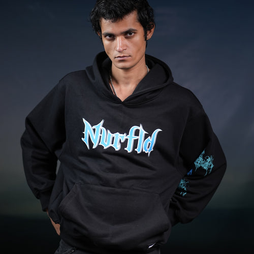 Black NVRFLD God hoodie statement piece with bold blue and white logo worn by male model