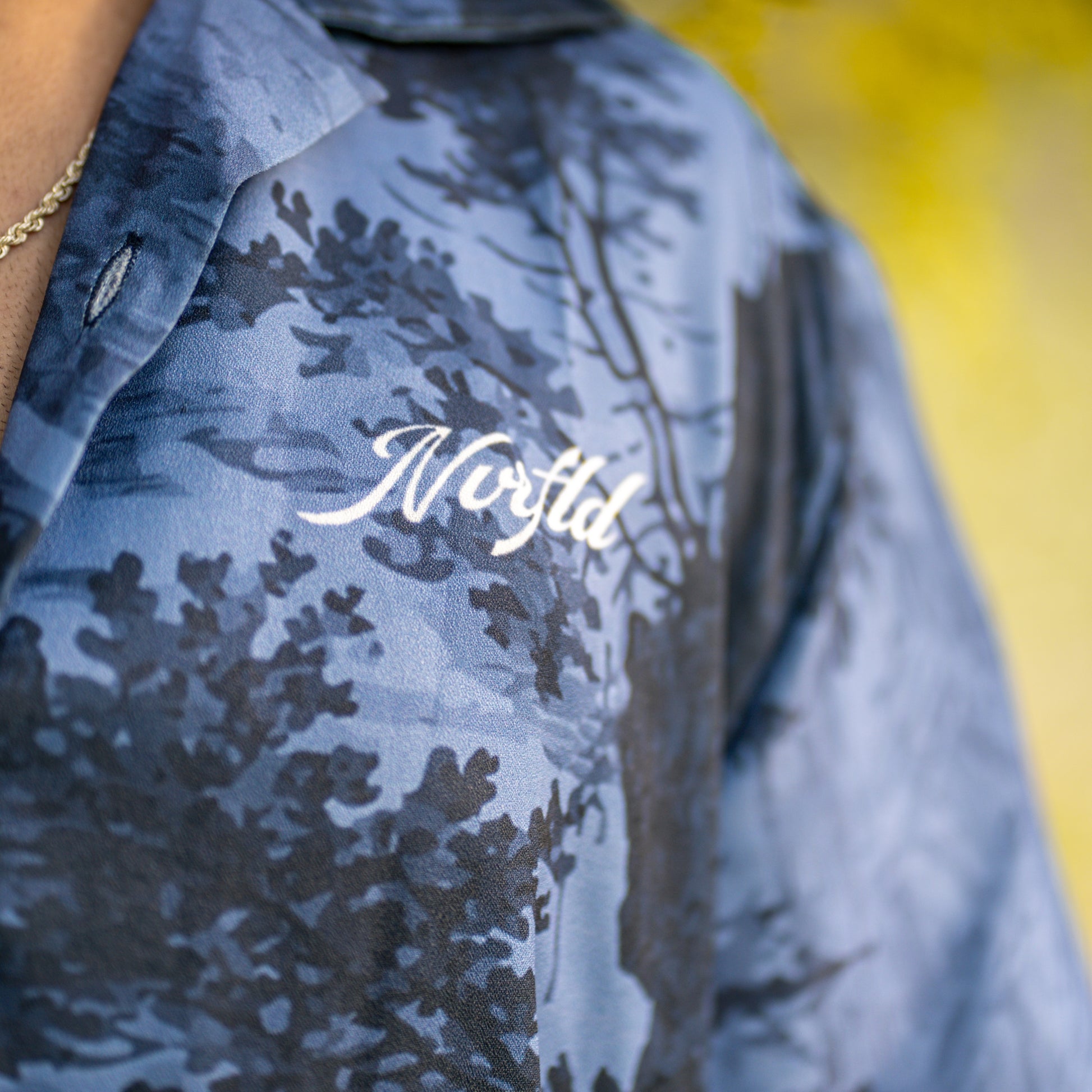 NVRFLD blue patterned contemporary statement shirt with Norfld logo on chest
