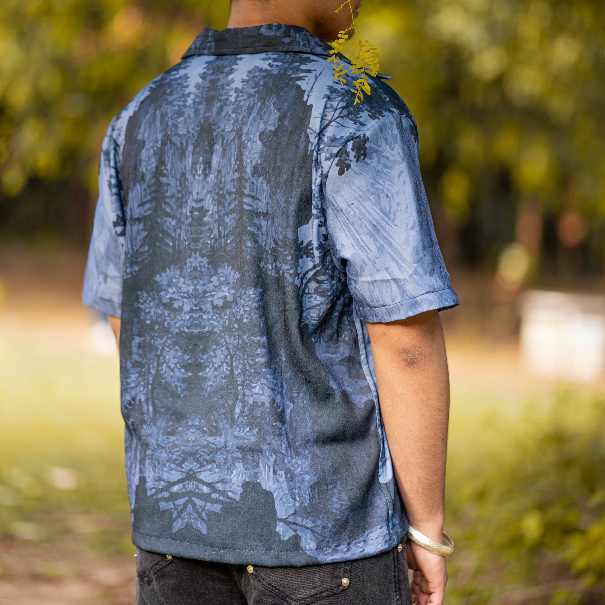 NVRFLD contemporary statement shirt featuring a blue and black abstract pattern on the back