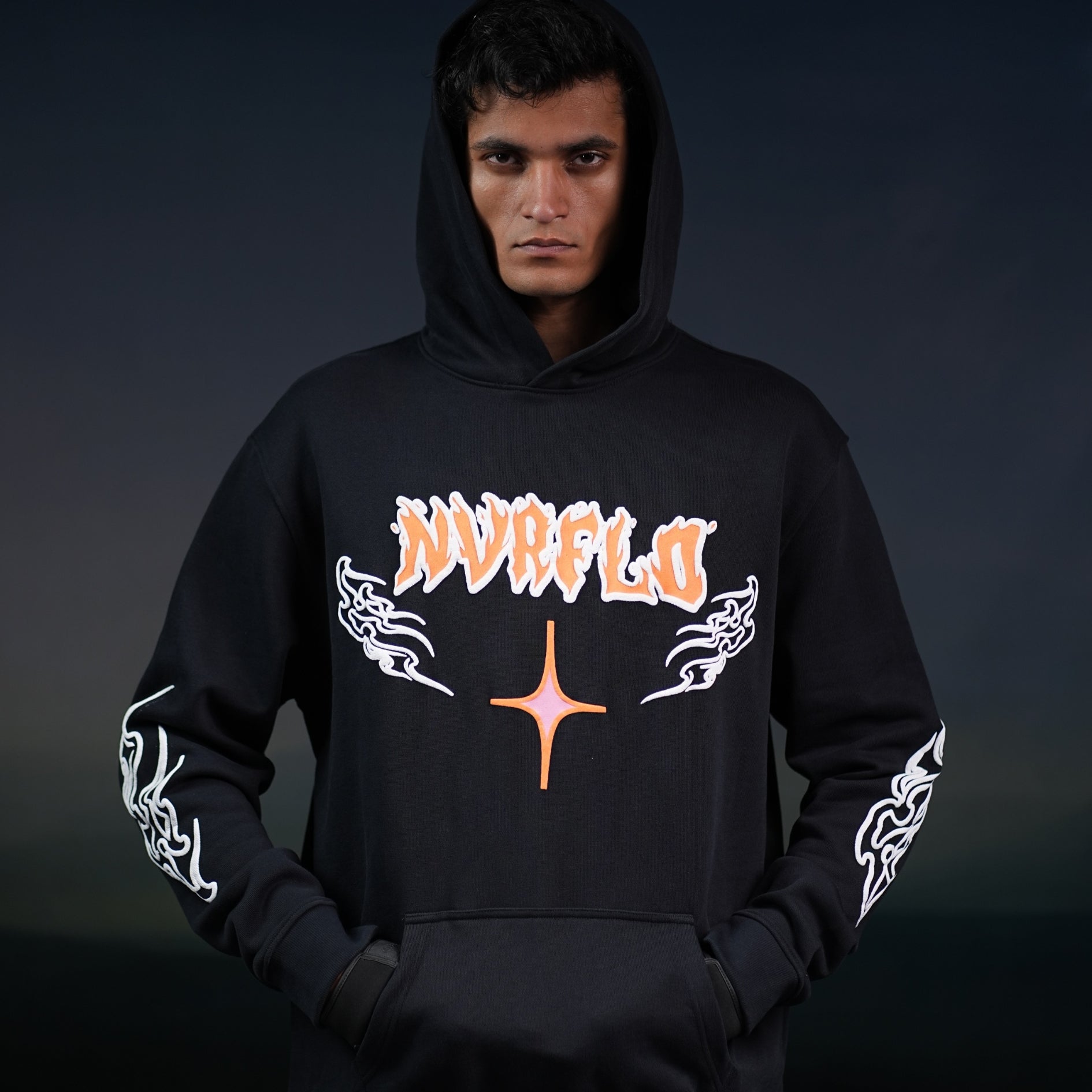 NVRFLD black graphic hoodie with orange and white flame designs and front logo print