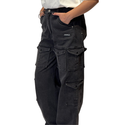 NVRFLD black utility cargo pants with multiple pockets shown on model with hands in pockets