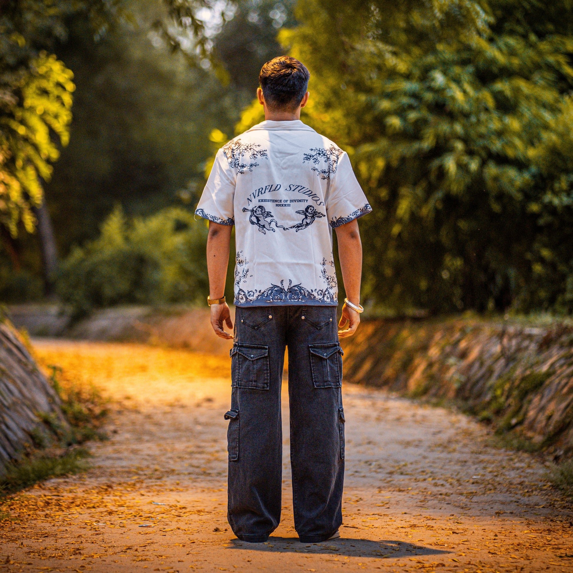 NVRFLD Renaissance shirt for men white with black ornate design worn by man standing outdoors